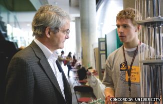 Edward Schroeder (right) from Kells Academy explains his Project Greenskies experiment to Marc Garneau, who encouraged the participants to be curious about life.